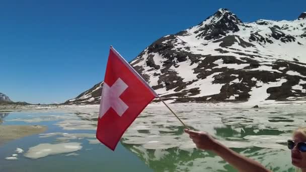 Swiss flag in SLOW MOTION on White lake — Stockvideo