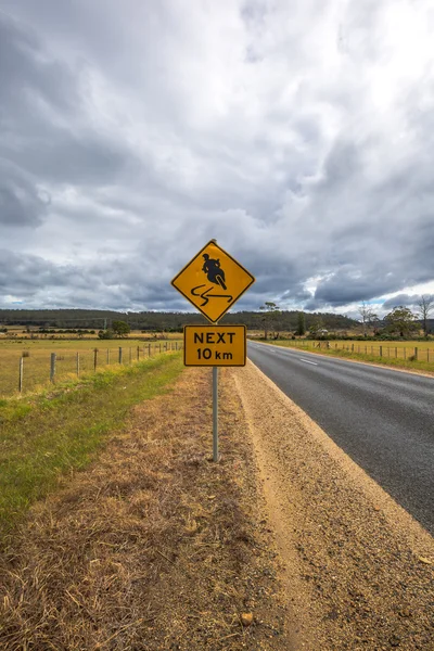 Motorcyclists sign road — Stock Photo, Image