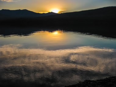 Lake McDonald at sunset clipart