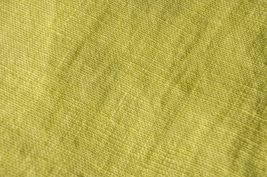 Dokulu sarı çarşaf arka planı. Doğa Kumaşı Tekstil. Katlanmış Kırışık Yüzey Pamuğu