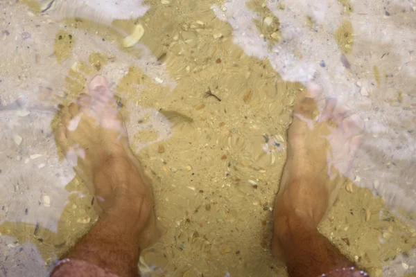 Feet of water and sand — Stock Photo, Image