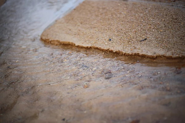 Przepływ wody i piasku — Zdjęcie stockowe