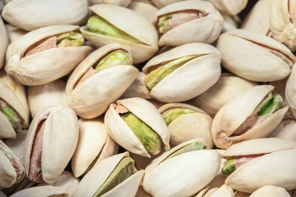 Textura y fondo de pistachos. Sabrosos pistachos de cerca. Vista superior. Puesta plana — Foto de Stock