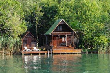Wooden House On Ada Bojana River, Montenegro clipart