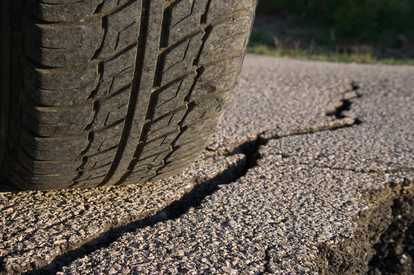 Tire And Cracked Asphalt