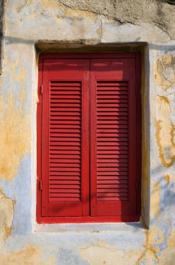 Window With Red Shutter Closed