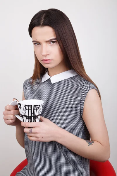 Beautiful  girl  in  dress  with cup — Stock Photo, Image