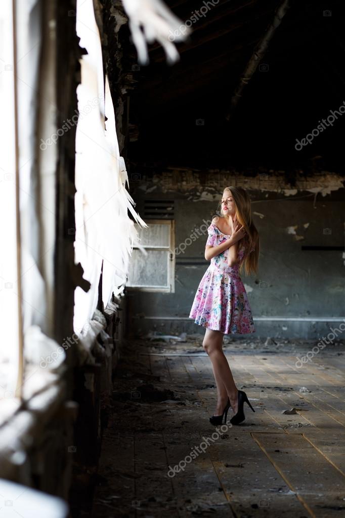 beautiful woman in abandoned house