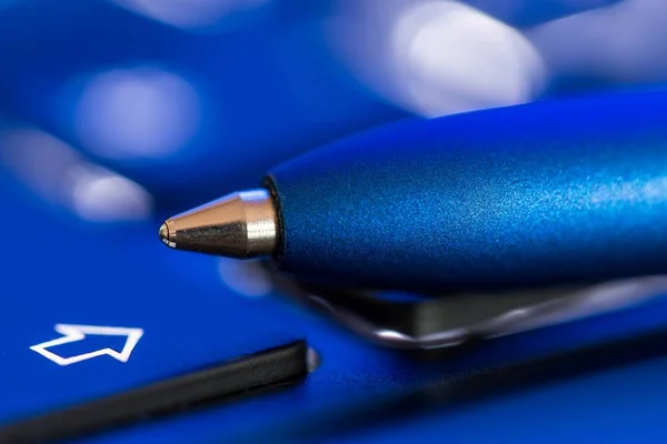 Tip of Blue Colored Pen Extreme Closeup with Blurred Background