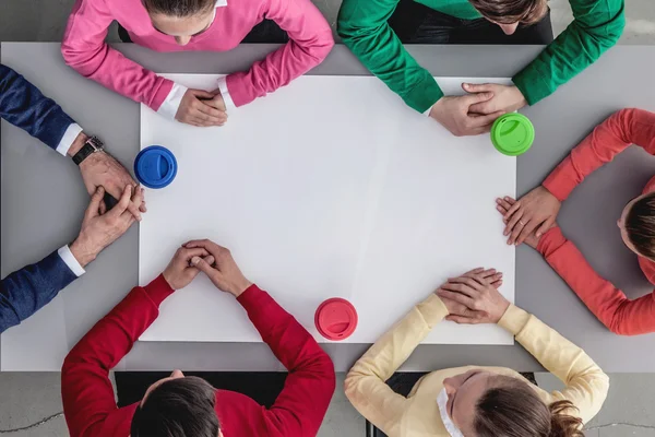 Team of workers around the table