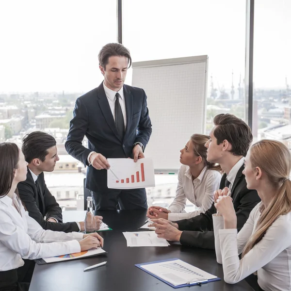 Business people discussing charts — Stock Photo, Image