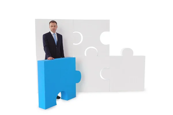 Uomo d'affari e puzzle — Foto Stock