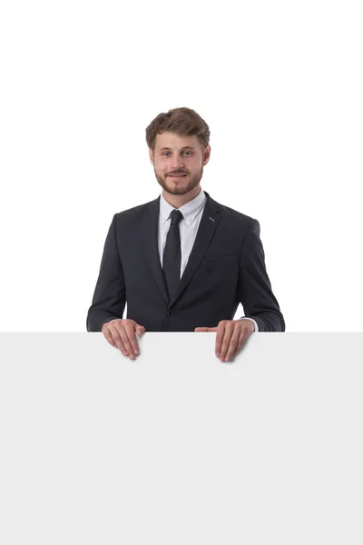 Junger Mann Anzug Zeigt Whiteboard Banner Auf Weißem Hintergrund — Stockfoto