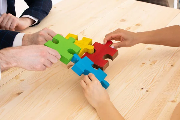 Multi Ethnic Group People Assembling Jigsaw Puzzle Together Hands Joining — Stock Photo, Image