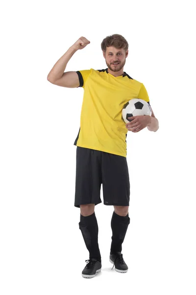 Ποδόσφαιρο Παίκτης Κρατά Μπάλα Δείχνει Μυών Κρατώντας Γροθιά Γιορτάζει Νίκη — Φωτογραφία Αρχείου