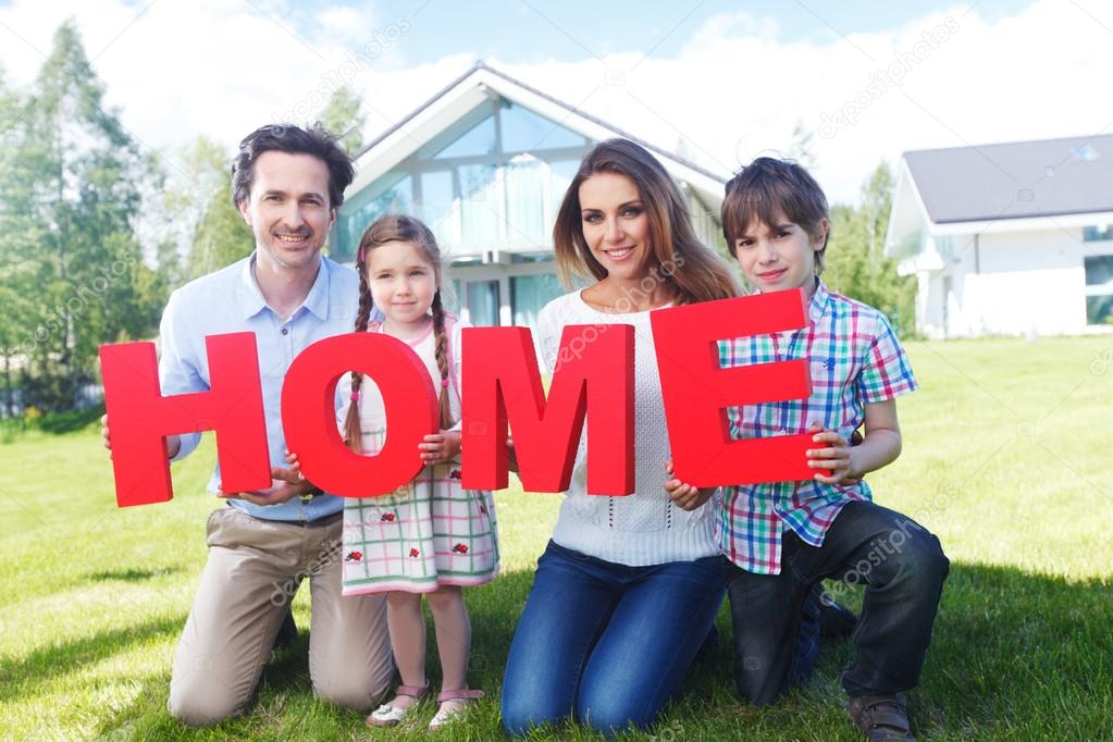 family holding home letters