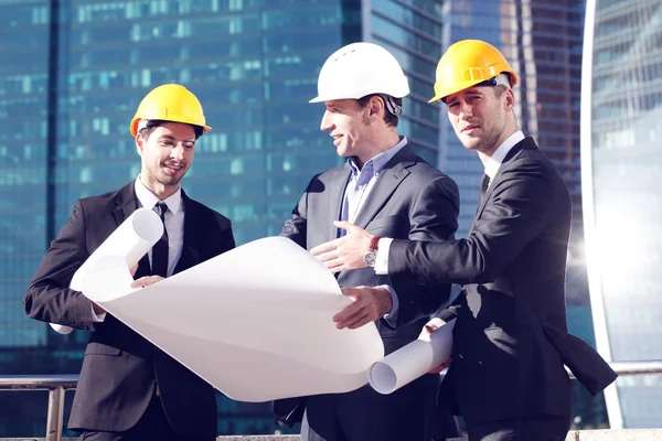 Architects with blueprint — Stock Photo, Image