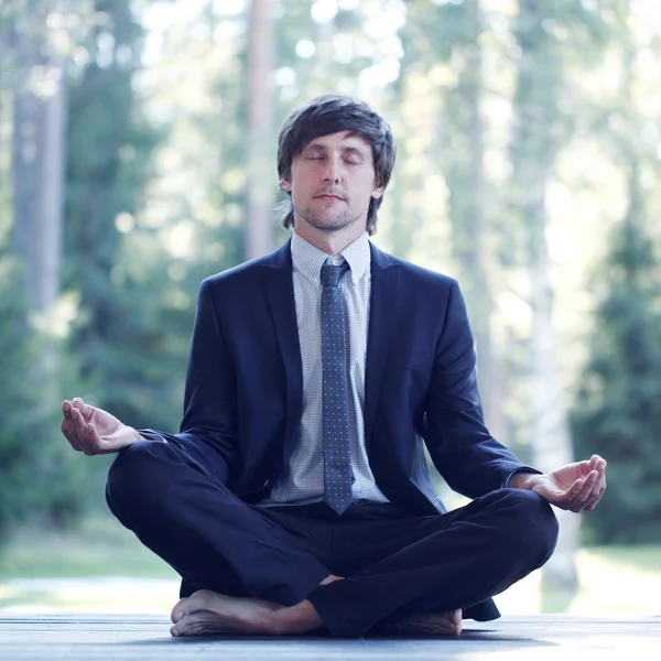 Businessman practicing yoga — Stock Photo, Image
