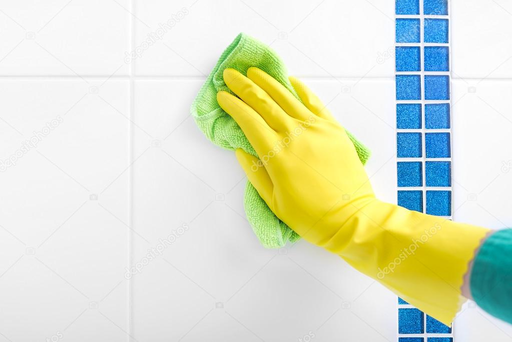 Hand wash a tile.