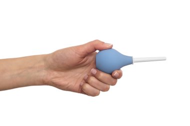 Enema in a hand on white background. clipart