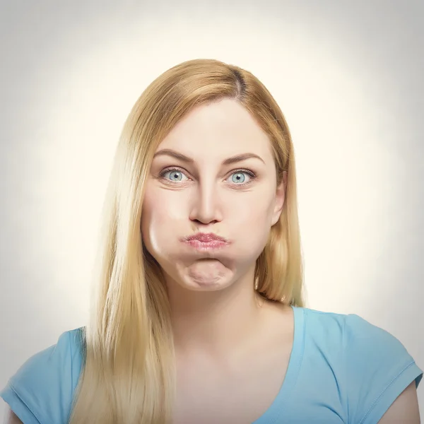 PoBlonde woman making pout Stock Image