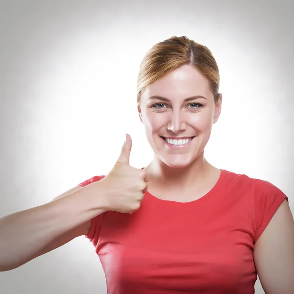 Blonde showing thumbs up. — Stock Photo, Image