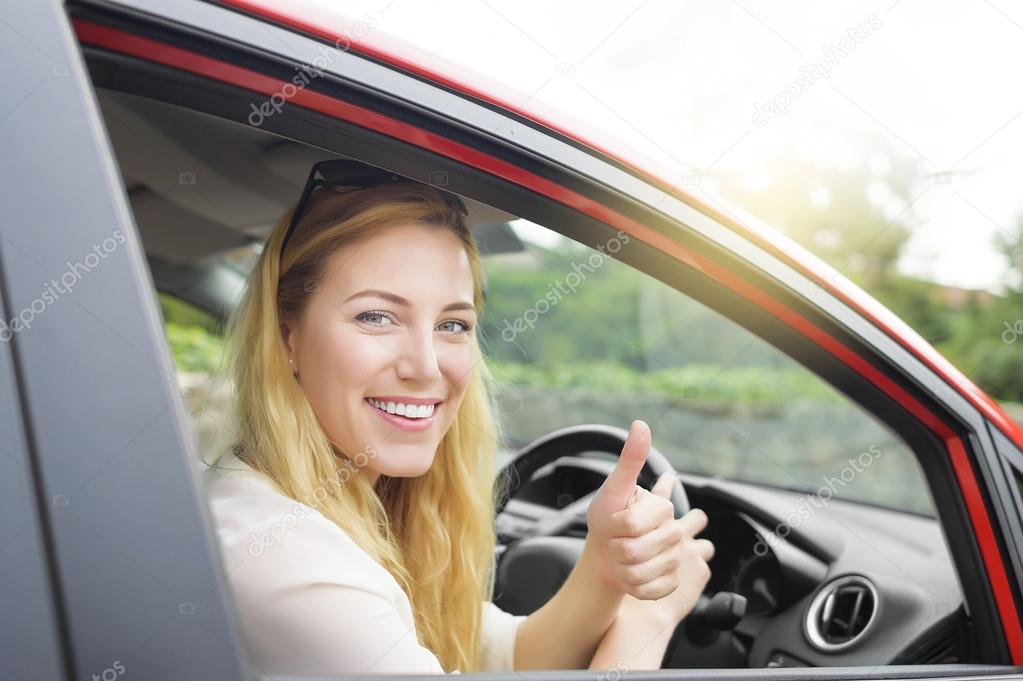 Woman in new car.