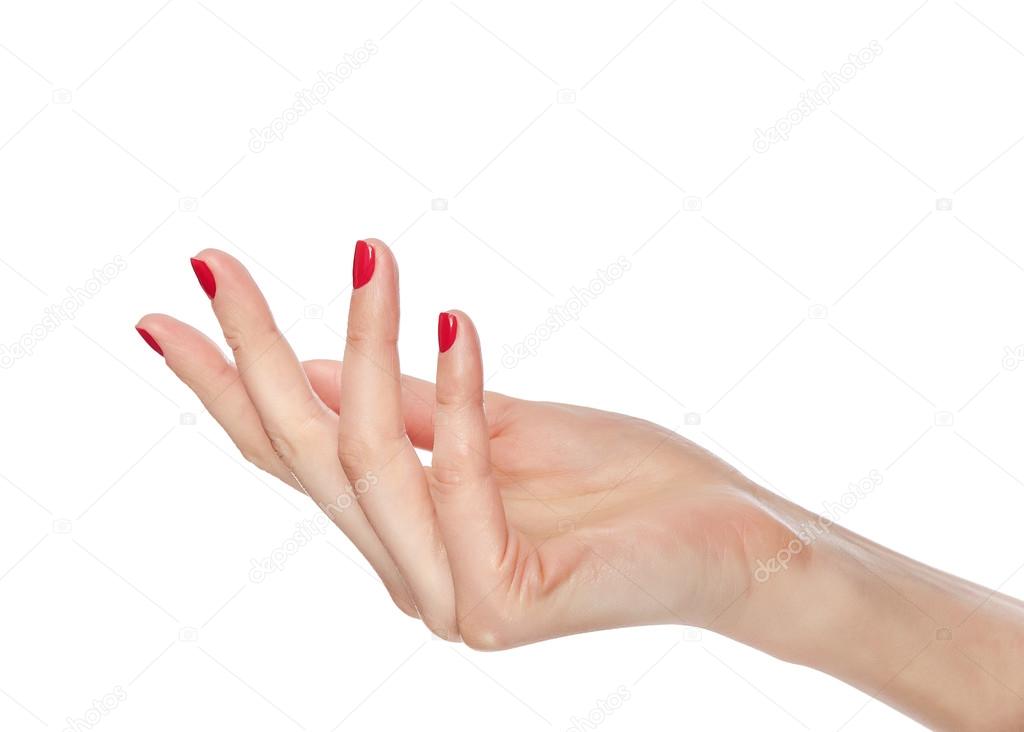Womens hands with red nail polish.