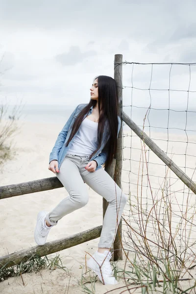 Young girl on the Baltic sea beach — Stok fotoğraf