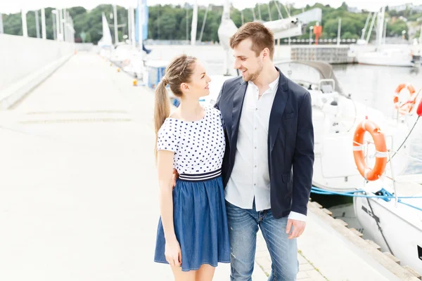 European couple relaxing on the sea beach hugging each other — Stock Photo, Image