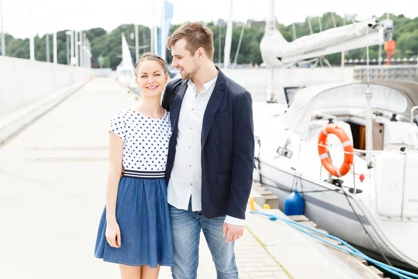 European couple relaxing on the sea beach hugging each other — Stock Photo, Image