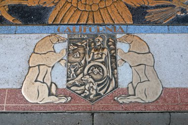 Bas relief plaque for California is inlaid into Hoover Dams plaza's surface, one of the seven states that fall within the Colorado River's basin. Hoover Dam, Arizona, Nevada, USA