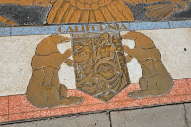 Bas relief plaque for California is inlaid into Hoover Dams plaza's surface, one of the seven states that fall within the Colorado River's basin. Hoover Dam, Arizona, Nevada, USA