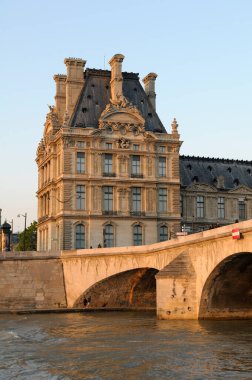 Pont Royal and the Louvre from the Seine River, Paris, France.