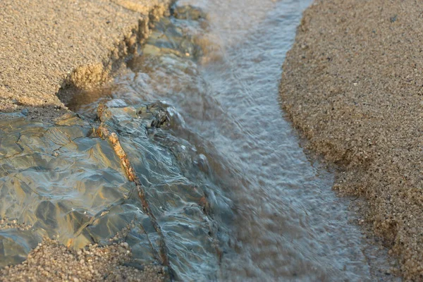 Fresh Rainwater Seeping Out Sand Cutting Path Sea Carlyon Bay — Stock Photo, Image