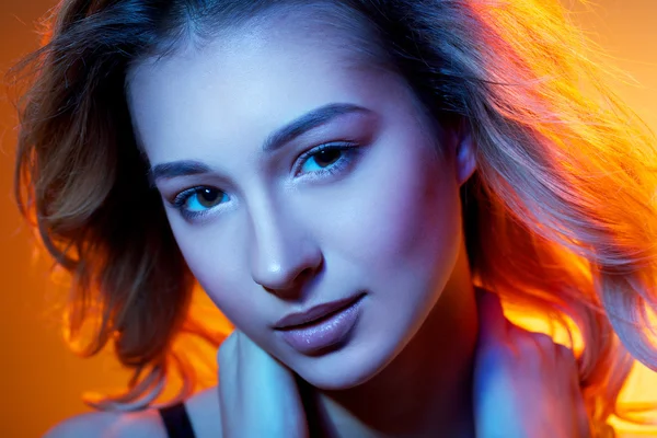 Woman in colored light — Stock Photo, Image