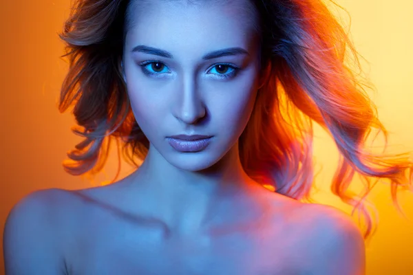 Woman in colored light — Stock Photo, Image
