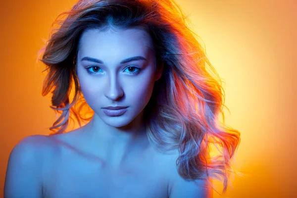 Woman in colored light — Stock Photo, Image