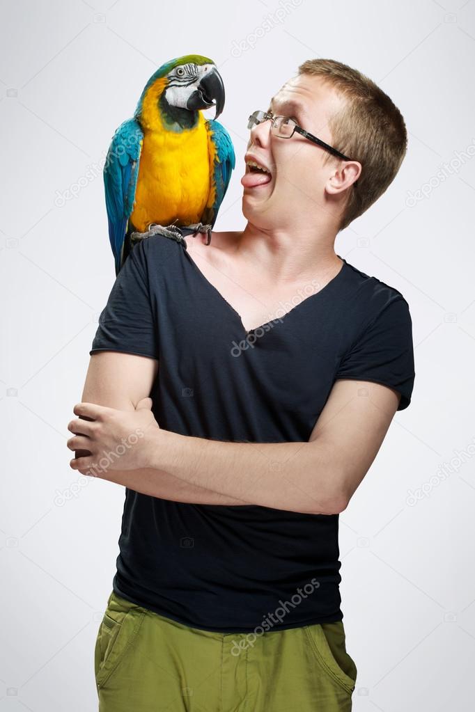 teenage boy with parrot