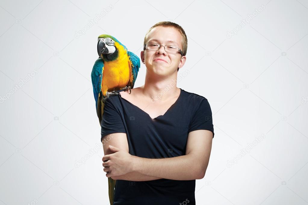 teenage boy with parrot