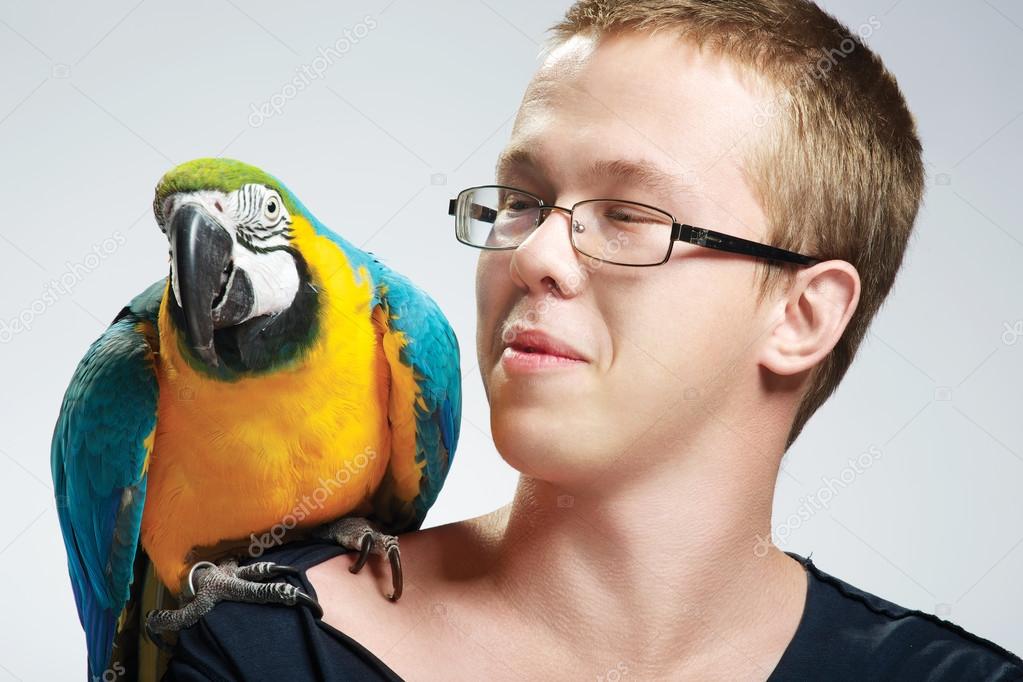 teenage boy with parrot