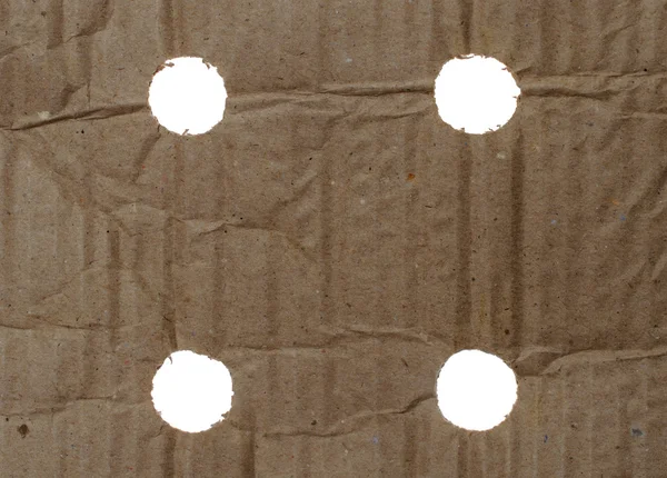 Текстура обгорткового паперу з отворами — стокове фото