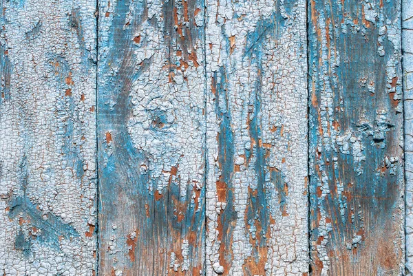Pintura desmenuzada en la puerta de las viejas tablas textura fondo — Foto de Stock