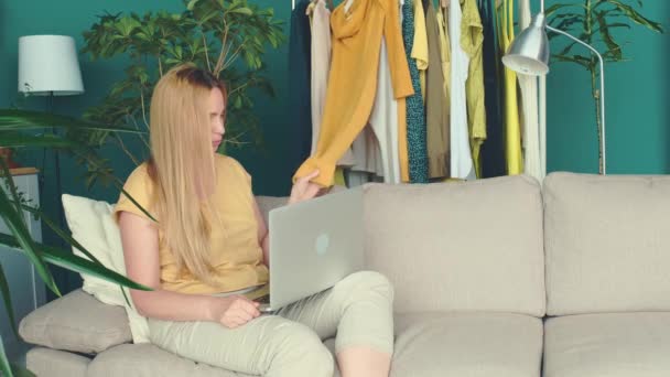 Middle Aged Blond Woman Sitting Sofa Communicates Online Laptop — Stock Video