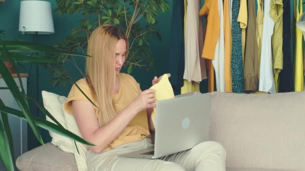 Middle Aged Blond Woman Sitting Sofa Communicates Online Laptop — Stock Video