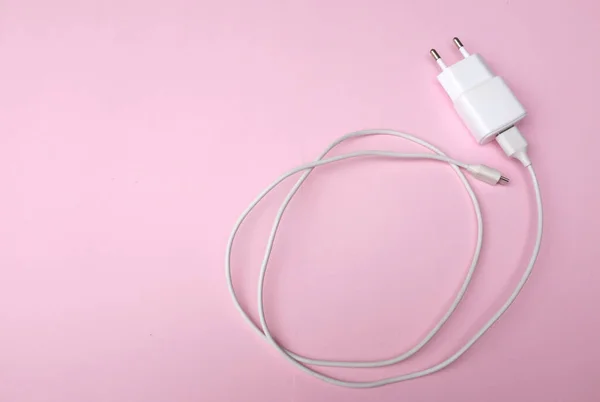 stock image Charger Adapter of smartphone color white on pink pastel Background