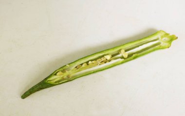 young raw okra, ladys finger, gombo, gumbo, bendee, quimbamto (hisbicus esculentus l.) vegetables .flat lay