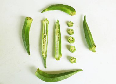 young raw okra, ladys finger, gombo, gumbo, bendee, quimbamto (hisbicus esculentus l.) vegetables .flat lay