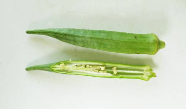 young raw okra, ladys finger, gombo, gumbo, bendee, quimbamto (hisbicus esculentus l.) vegetables .flat lay