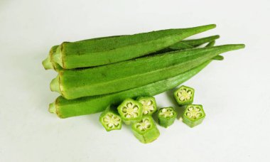 young raw okra, ladys finger, gombo, gumbo, bendee, quimbamto (hisbicus esculentus l.) vegetables .flat lay